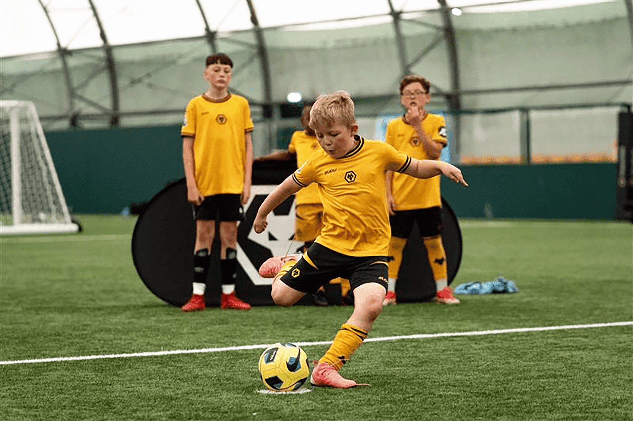 Boy-home-kit-kicking-ball-1